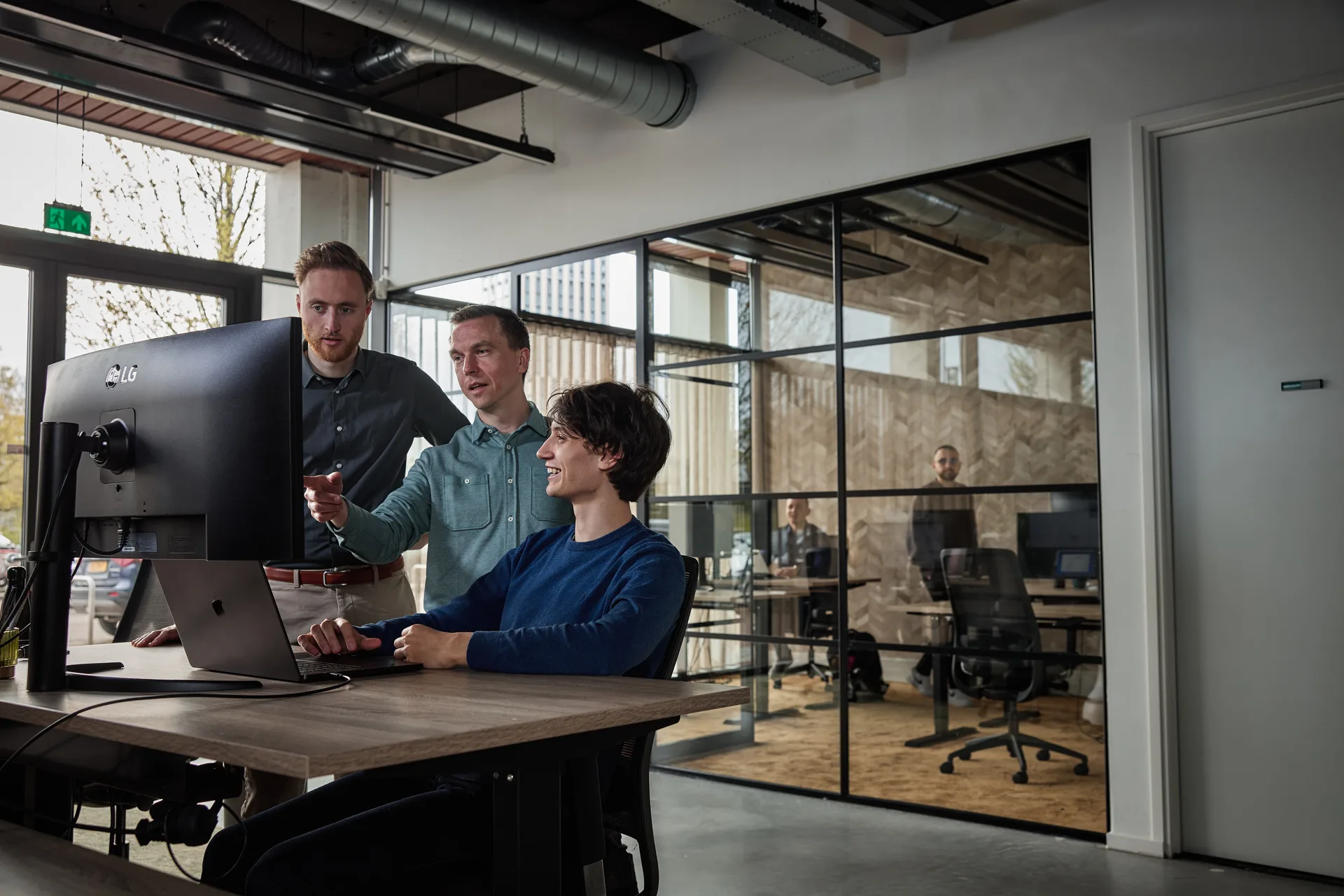 Three Foreside engineers working together at one screen